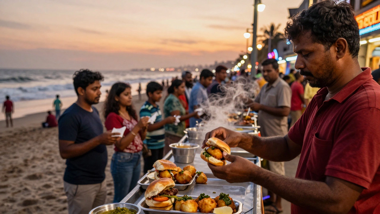 Mumbai street vendor assembling vada pav at Chowpatty Beach as sunset glows behind.